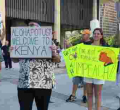 Protesters Carrying "Welcome to Kenya" Placards Welcome President Donald Trump in Hawaii