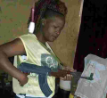 Photos of Gun-Wielding Kenyan Woman Go Viral Online, Kenyans Call for Her Arrest