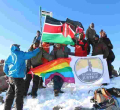 Members of Kenyan Gay Community Hoist Rainbow Flag at the Peak of Mt Kenya