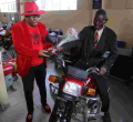 76-Year-Old Man Who Cycled 223Km to Attend Moi's Burial Receives Motorbike, Posho Mill from Sonko