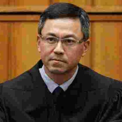 Judge Derrick K. Watson of the United States District Court of Hawaii  Immigration: Federal Judge Blocks New Trump Travel Ban