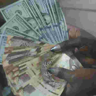 A cashier at a Nairobi Forex Bureau Kenya's Booming Shilling Pinches Remittance Inflows