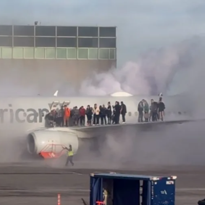 Airplane Passengers American Airlines Passengers Evacuated via Wing After Engine Fire at Denver Airport