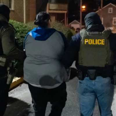 Police ICE ICE Teams Up with Big Tech to Enhance Migrant Tracking System