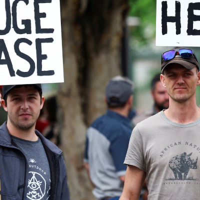 Demonstrators  First White South Africans Arrive in the US Under Trump Refugee Program