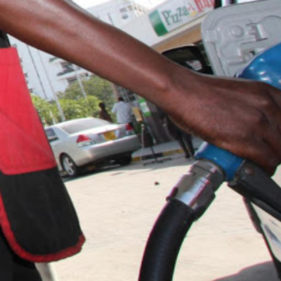 Fuel Attendant Holding a Fuel Pump Petrol Users Pay More in Taxes Than Product Cost