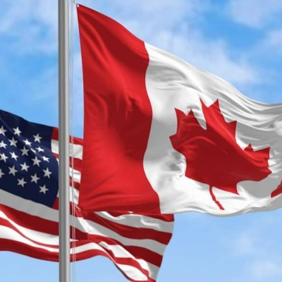 Canada and USA Flags Green Card or Canadian Permanent Residency? What Skilled Workers Need to Know