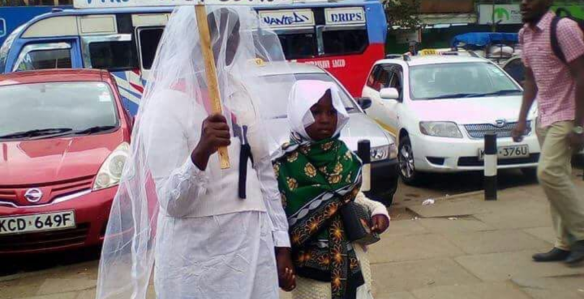 Woman Carries Placard in Streets of Nairobi in Search of Husband