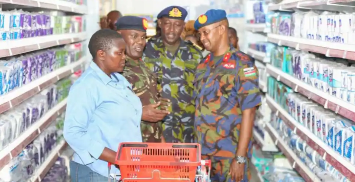 KDF Officers Interact With a Shopper at one of DEFCO's Retail Chains The Rise of KDF's Supermarket Chain Generating Sh1 Billion in Turnover