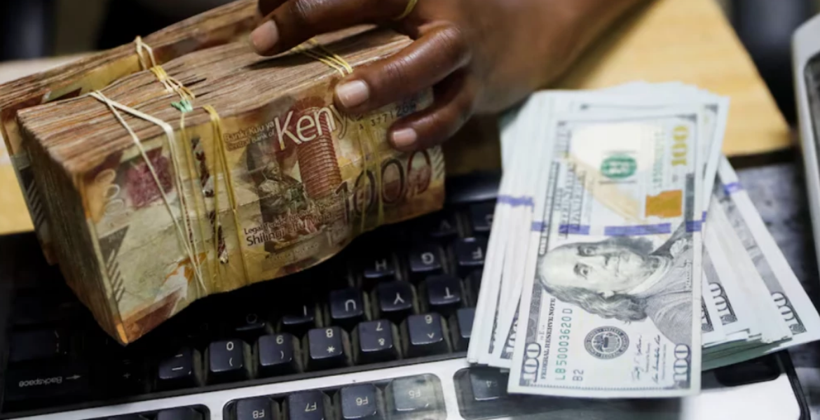 A Teller Handles Kenya shilling Banknotes and U.S. Dollar Banknotes CBK Actions Keep Kenyan Shilling Stable Amid Global Fluctuations