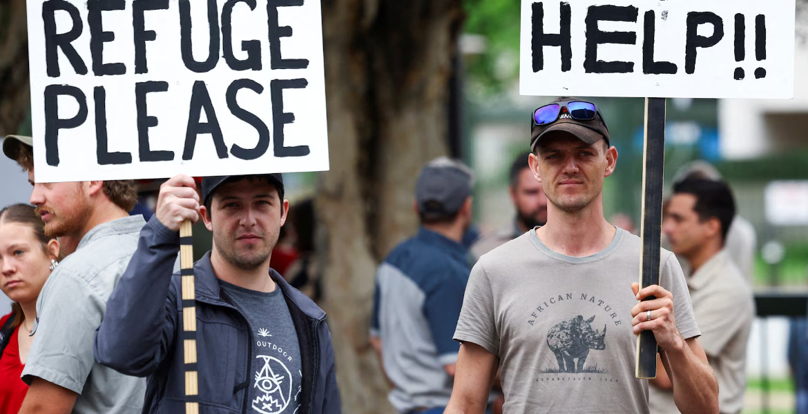 Demonstrators First White South Africans Arrive in the US Under Trump Refugee Program